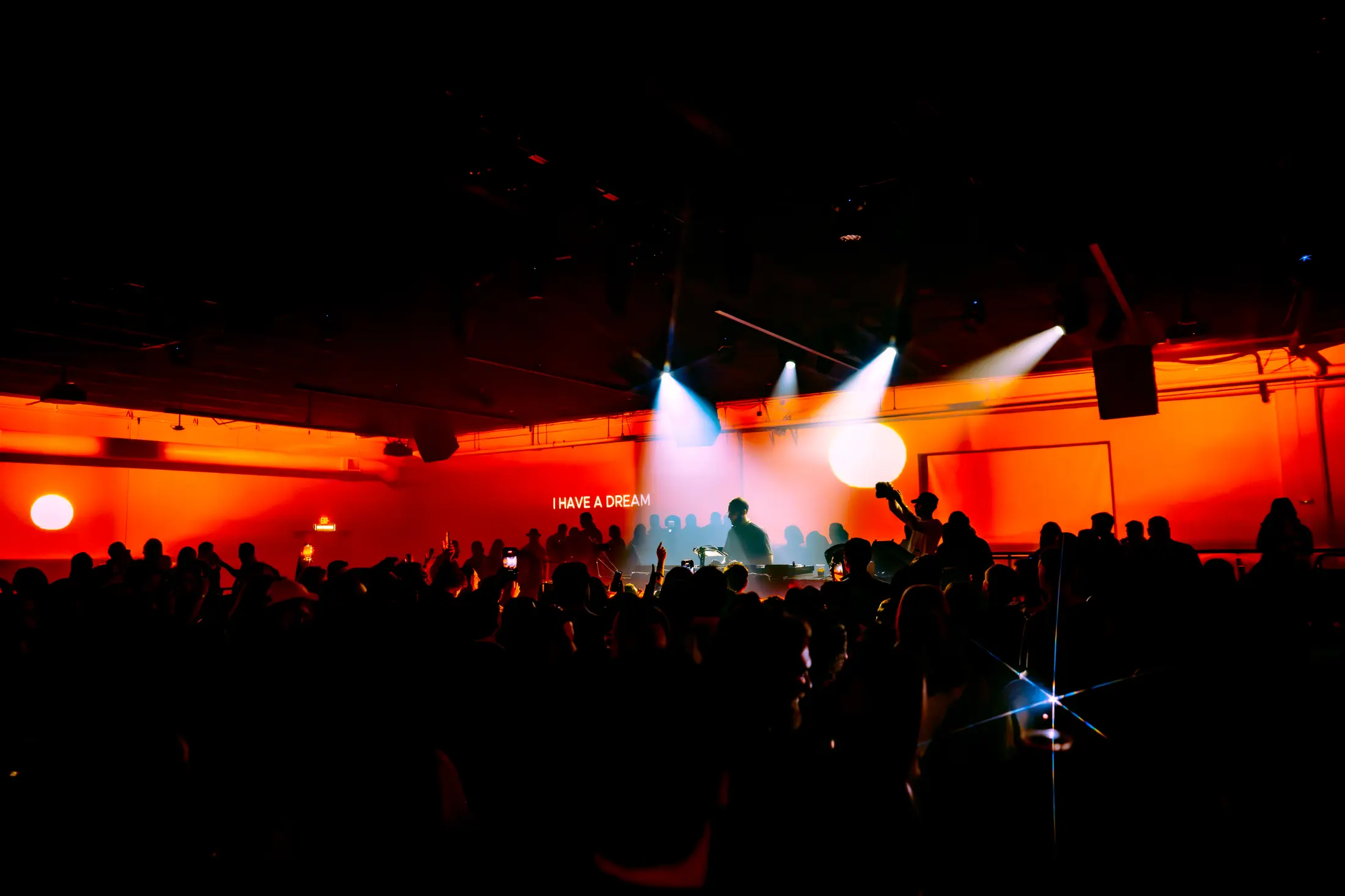 Full room with custom visuals projected across every wall during a Reunion event